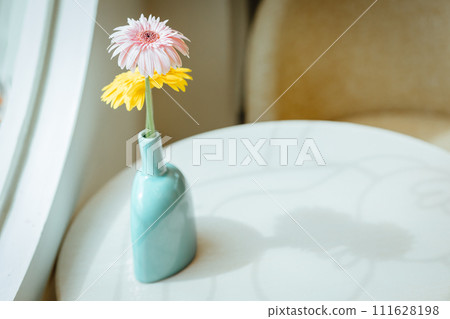 Minimalism cafe coffeeshop table flower pot decoration at window side vintage color tone 111628198