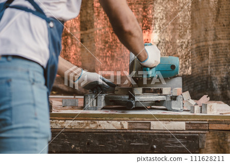 Carpenter man cut wood making masterpiece woodworks handcrafted make wooden furniture in wood workshop. 111628211