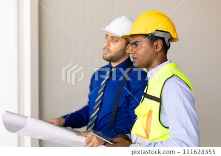 engineer builder team working with architect designer work inspect large building factory construction project with floorplan engineer builder team working with architect designer work inspect large building factory construction project with floorplan 111628355