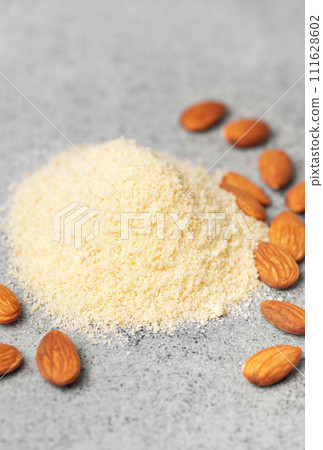 Fresh almond flour  and almonds Fresh almond flour  and almonds 111628602
