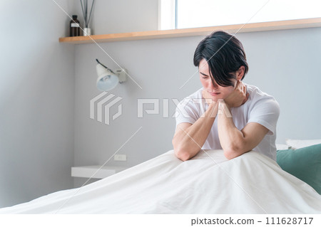 A man who is unwell in bed (fever, cold, sore throat, feeling tired) A man who is unwell in bed (fever, cold, sore throat, feeling tired) 111628717