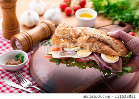 Baguette sandwich with plenty of toppings 111629881