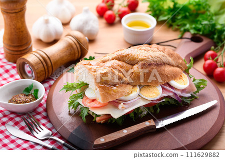 Baguette sandwich with plenty of toppings 111629882