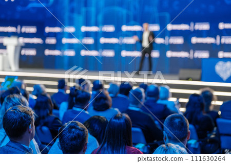 Professional speaker addressing audience at business conference event 111630264