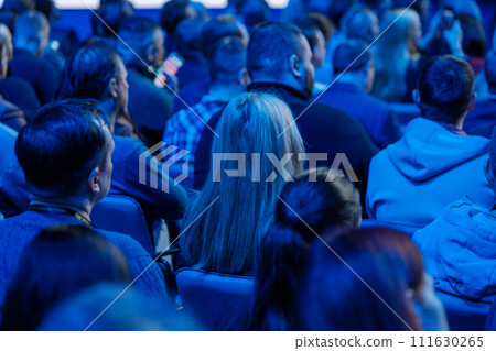 Audience listening intently at a professional conference event 111630265
