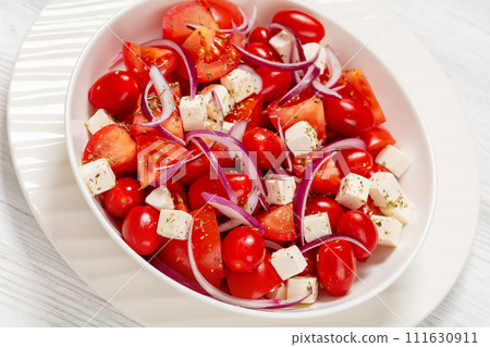 tomato salad with red onion and white cheese tomato salad with red onion and white cheese 111630911