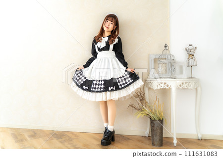 Japanese woman in maid uniform Japanese woman in maid uniform 111631083