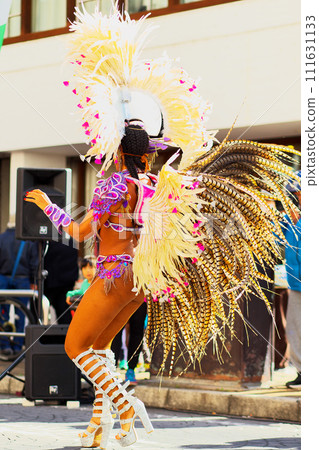 Brazilian costumes dancing samba on the streets of the city Brazilian costumes dancing samba on the streets of the city 111631133