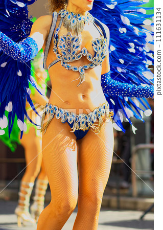 Brazilian costumes dancing samba on the streets of the city Brazilian costumes dancing samba on the streets of the city 111631134