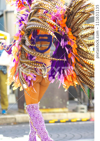 Brazilian costumes dancing samba on the streets of the city Brazilian costumes dancing samba on the streets of the city 111631135