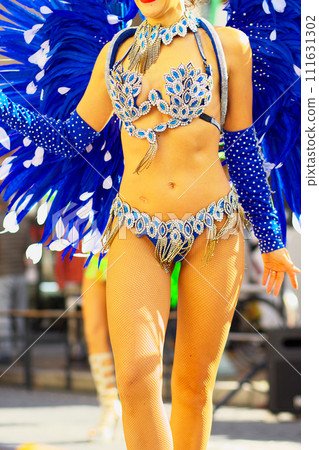 Brazilian costumes dancing samba on the streets of the city Brazilian costumes dancing samba on the streets of the city 111631302