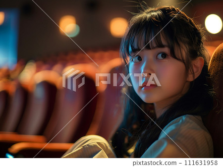 Woman watching a movie 111631958