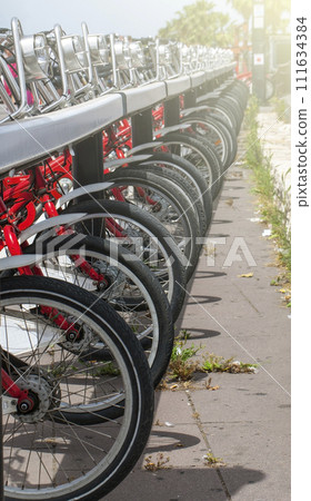 Row of bikes available to sell or rent in Spain on soft sunlight Row of bikes available to sell or rent in Spain on soft sunlight 111634384