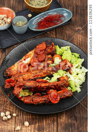 Roasted yummy pork ribs in sauce. 111636295