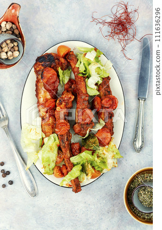 Stewed pork ribs in sauce. 111636296