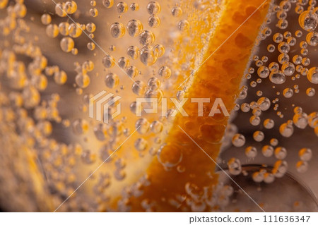 orange in a glass of carbonated water orange in a glass of carbonated water 111636347