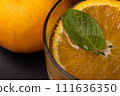 Carbonated, mint and orange in a glass 111636350