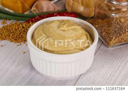 Dijon mustard sauce in the bowl 111637164