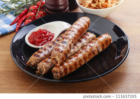 Grilled sausages with cabbage and sauce 111637205