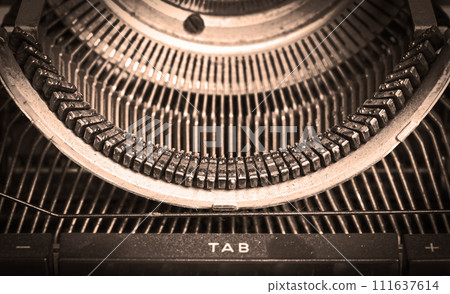 Broken metal typewriter, vintage object Broken metal typewriter, vintage object 111637614