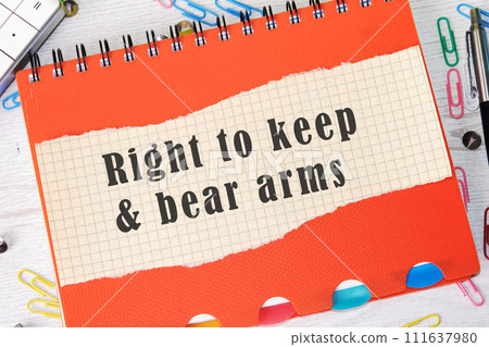 right to keep and bear arms text written on a piece of paper in a cage on the background of an orange notebook cover right to keep and bear arms text written on a piece of paper in a cage on the background of an orange notebook cover 111637980