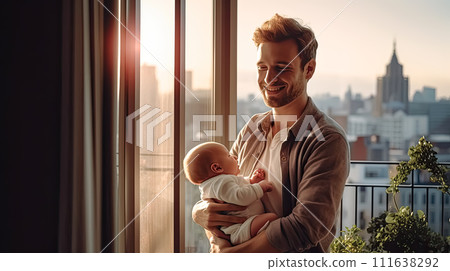 a dad tenderly holds his baby in his arms. a dad tenderly holds his baby in his arms. 111638292
