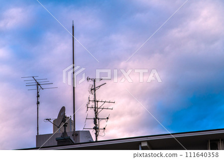 Tokyo cityscape in Japan Antenna and clouds installed on the roof of an apartment building... What will be the TV in the future... 111640358