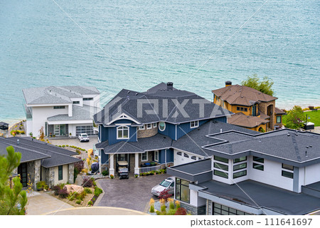 A perfect neighborhood. Luxury houses at waterfront of Kalamalka lake A perfect neighborhood. Luxury houses at waterfront of Kalamalka lake 111641697