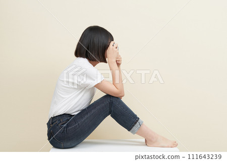 A woman sitting and taking pictures 111643239