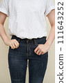 a woman's hand and jeans 111643252