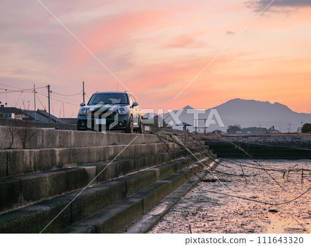 Cars parked at a boat dock at dusk Cars parked at a boat dock at dusk 111643320