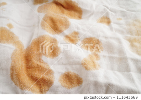 Dirty spicy sauce stain on cloth to wash with washing powder, cleaning housework concept. Dirty spicy sauce stain on cloth to wash with washing powder, cleaning housework concept. 111643669