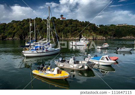Old Harbor With Boats In The Village Fishguard At The Atlantic Coast Of Pembrokeshire In Wales, United Kingdom Old Harbor With Boats In The Village Fishguard At The Atlantic Coast Of Pembrokeshire In Wales, United Kingdom 111647115