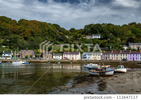 Old Harbor With Boats In The Village Fishguard At The Atlantic Coast Of Pembrokeshire In Wales, United Kingdom Old Harbor With Boats In The Village Fishguard At The Atlantic Coast Of Pembrokeshire In Wales, United Kingdom 111647117