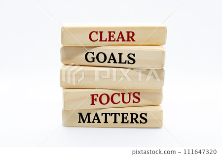 Clear goals and focus matters text on wooden blocks with white cover background 111647320