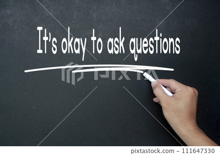 Hand writing It is okay to ask questions affirmation on black board. Affirmation concept 111647330