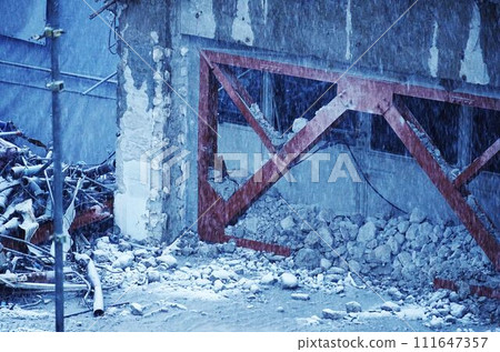 Ruins and demolition site on a snowy day 111647357