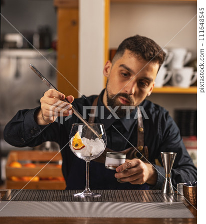 Expert barman is making cocktail Expert barman is making cocktail 111648545