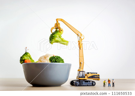 Miniature people making salad. Cooking concept 111650533