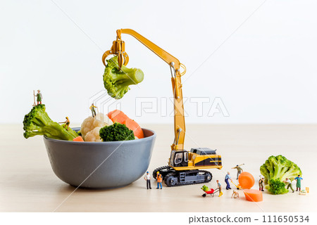 Miniature farmers making salad. Cooking concept 111650534
