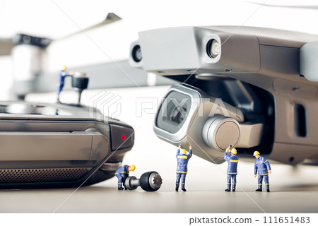 Group technicians preparing drone for the first flight 111651483