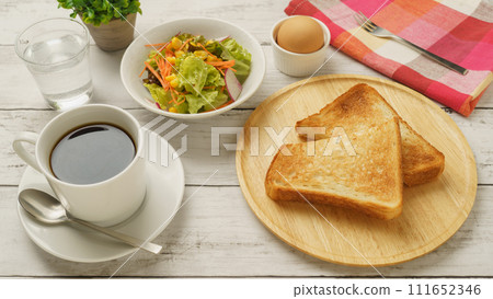 Morning set image of coffee, toast, boiled egg, and salad 111652346