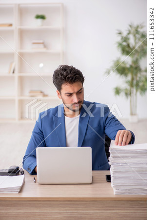 Young male employee working in the office 111653342