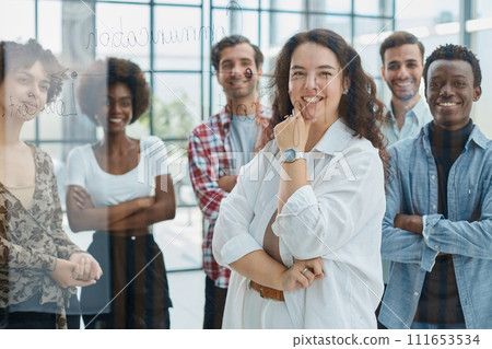 business woman with her staff in background at office 111653534