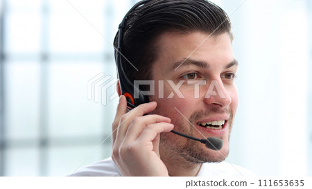 Male call center worker close-up in office working 111653635