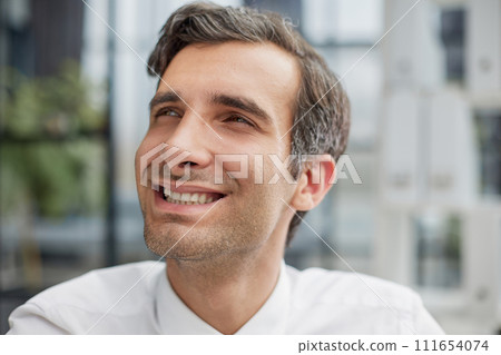 Confident young businessman posing in the office 111654074