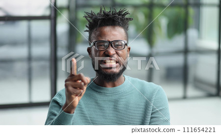 young african american man showing quiet business young african american man showing quiet business 111654221