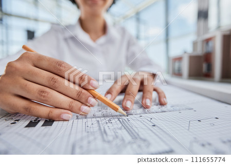 female architect designer working on blueprints female architect designer working on blueprints 111655774