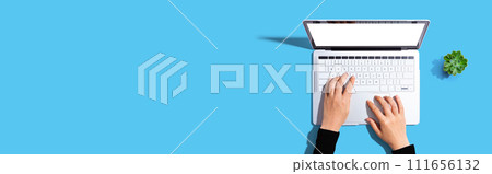 Person using a laptop computer Person using a laptop computer 111656132