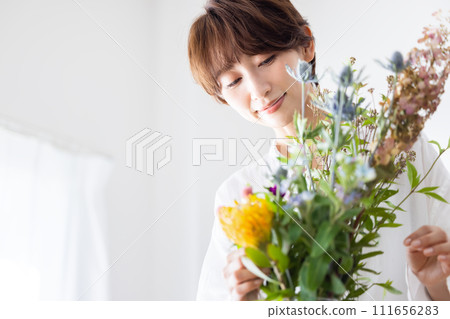 A woman with flowers A woman with flowers 111656283